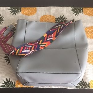 Gray tote with tribal strap